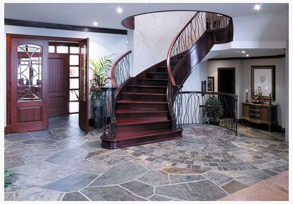 stairway with three door barrier one piece of furniture two plant floor with slate and frame